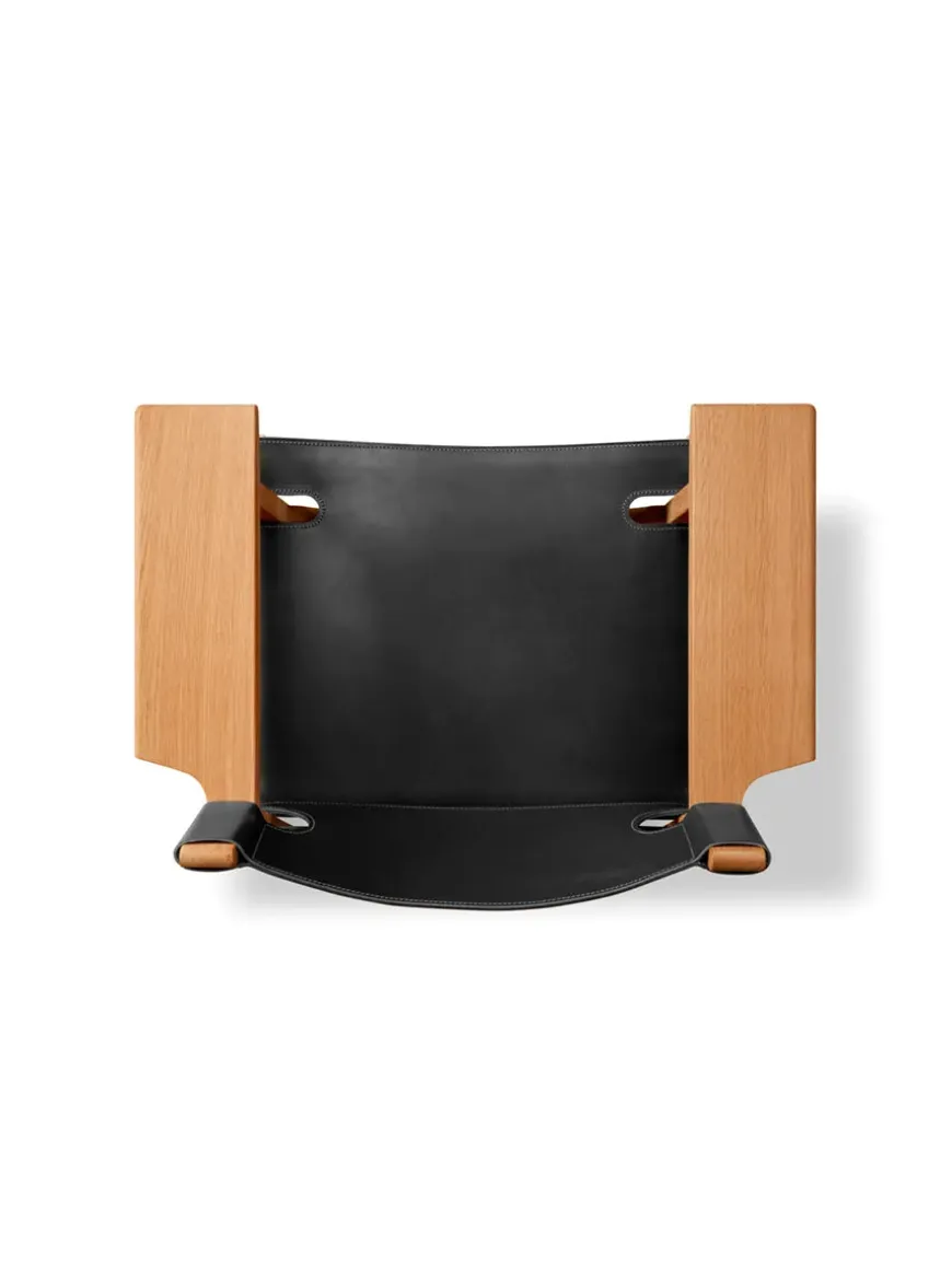 Den Spanske Stol i sort læder, eg sort lak af Børge Mogensen