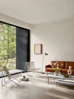 PK4 Loungestol i natur, sort stel af Poul Kjærholm